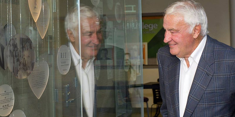 Tom Golisano viewing the Golisano archives exhibit at RIT.