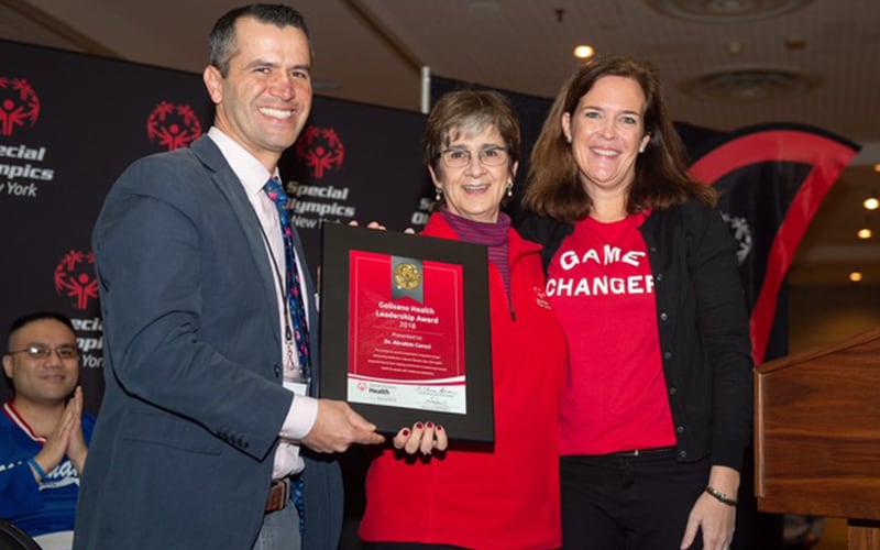 Dr. Abrahim Carcoi accepts the Special Olympics 2018 Golisano Health Leadership Award for New York State