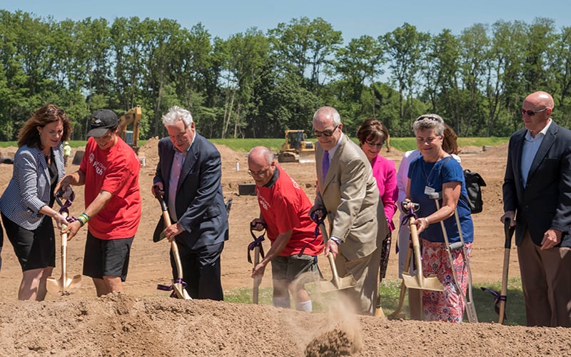 Tom Golisano and a group of people with shovels at the Golisano Training Center groundbreaking