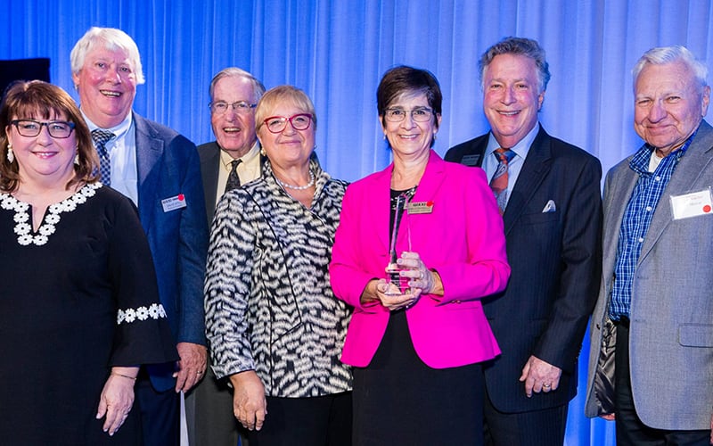 Ann Costello and Golisano Foundation board members accepting an award