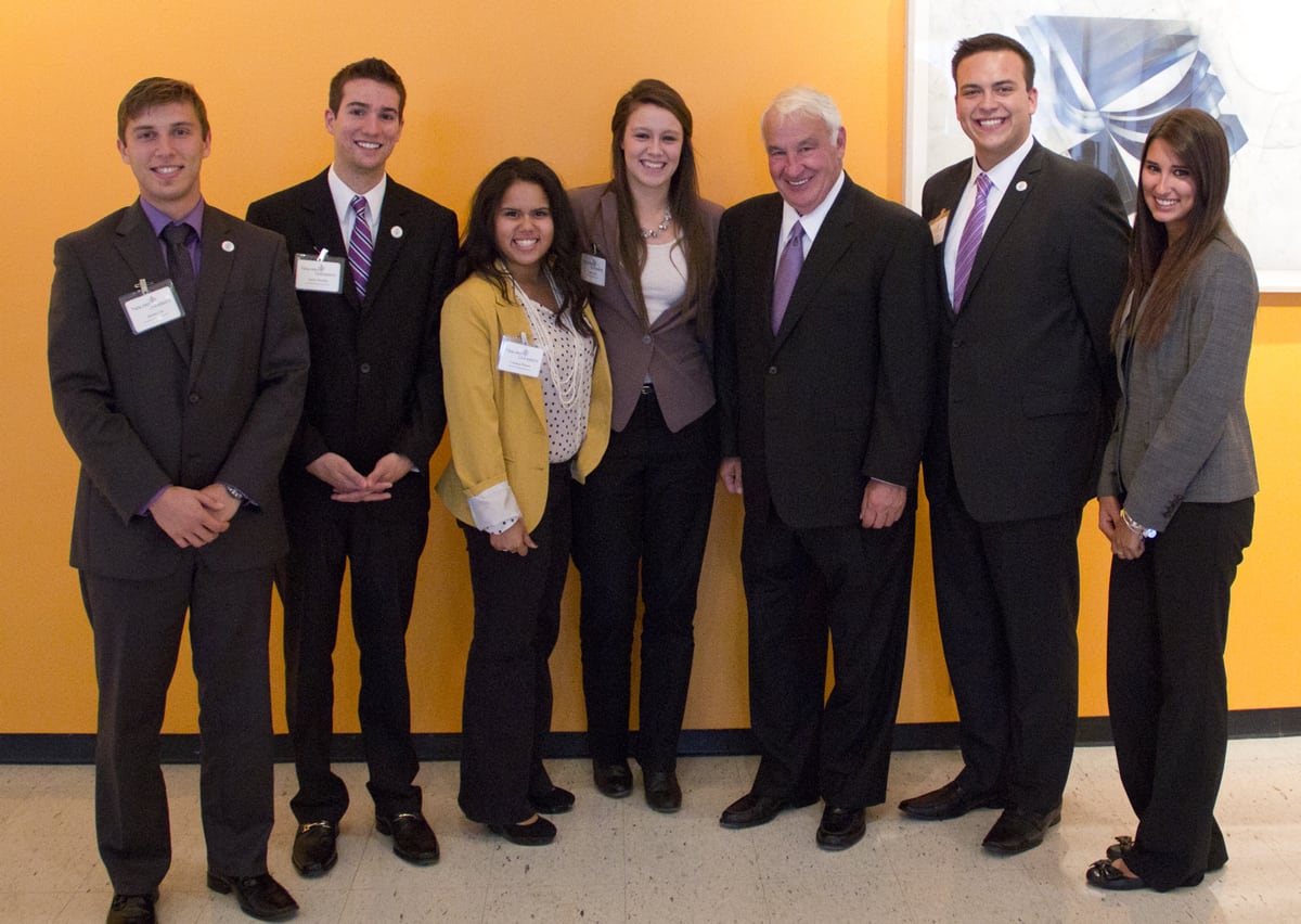 Tom Golisano with a group of people at the Golisano Center for Integrated Sciences ribbon cutting event