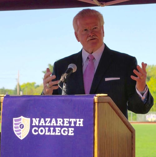 Speech being given on athletic track at Nazareth College