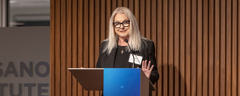 Mary Walsh Boatfield at a podium on a stage.